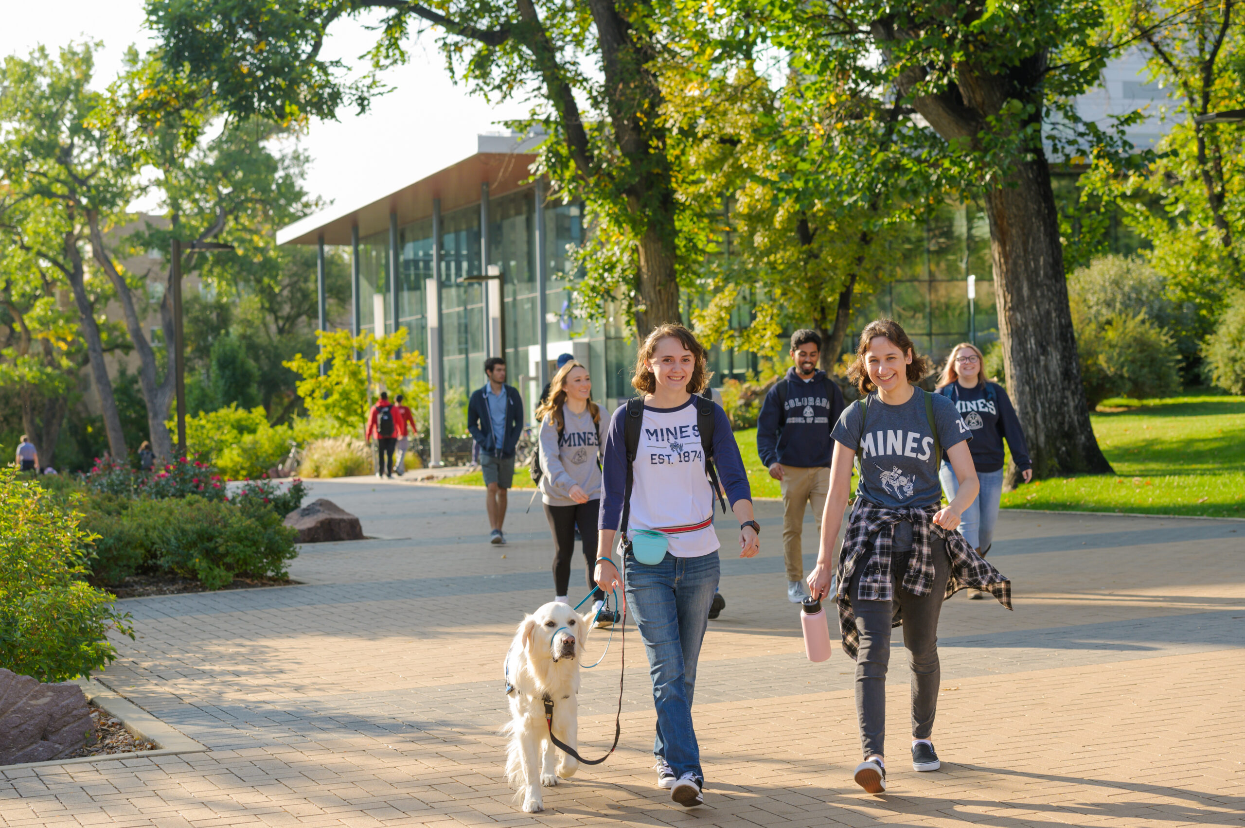 Students walking their dog on the Colorado School of Mines campus