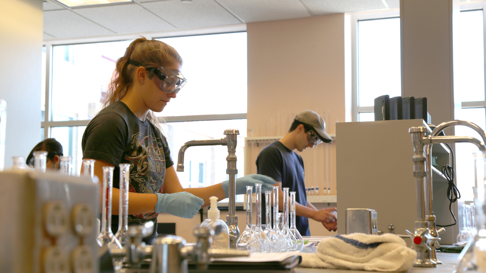 Students work on experiments in their chemistry lab