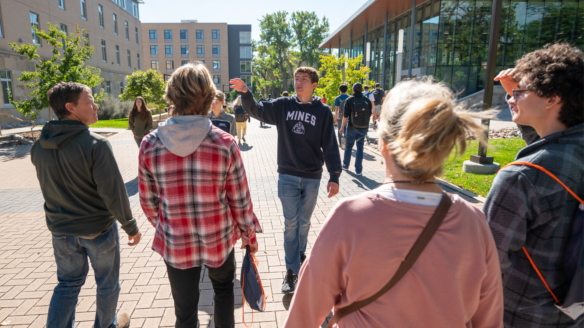 A family is guided on a campus tour