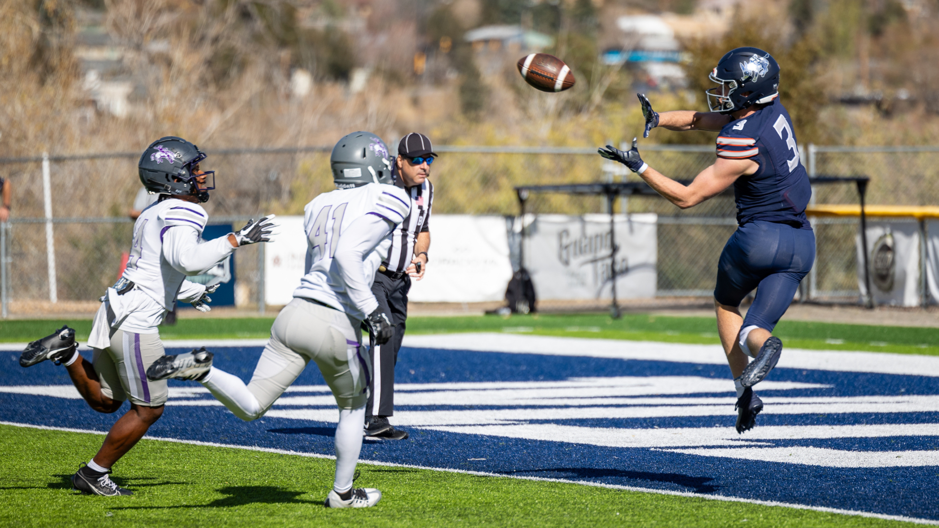 A Mines football player catches a ball in the end zone for a touchdown