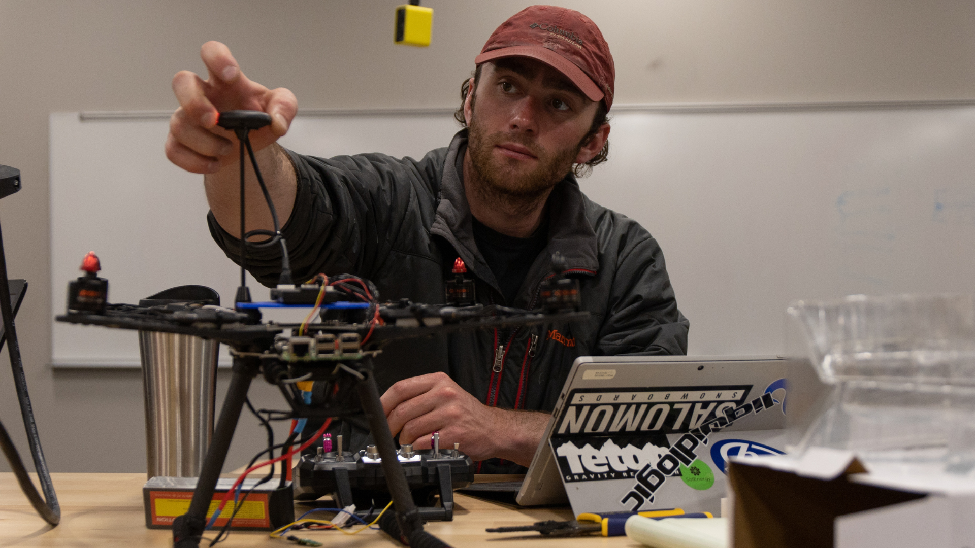 A student puts the final touches on a drone in the geophysics maker space