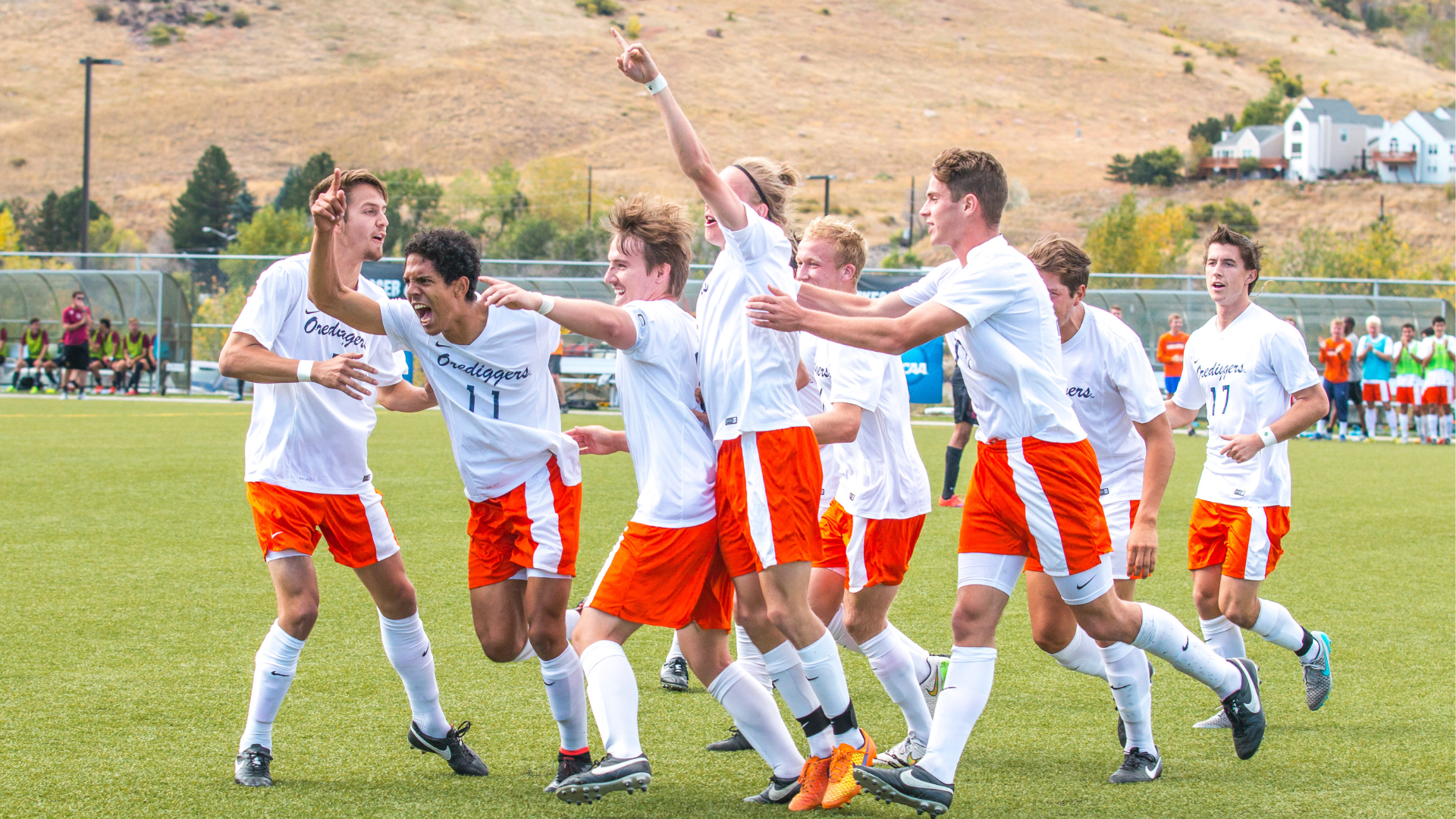 The Men's Soccer team celebrates after a goal